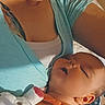 Aurora is registered to the contest to win money with this photo: baby, sleeping, adult, smiling, plush_toy, indoor, closeup, person, child, face, bed, resting, orange_clothing, blue_shirt, skin, head, comfort, family, relaxation, home