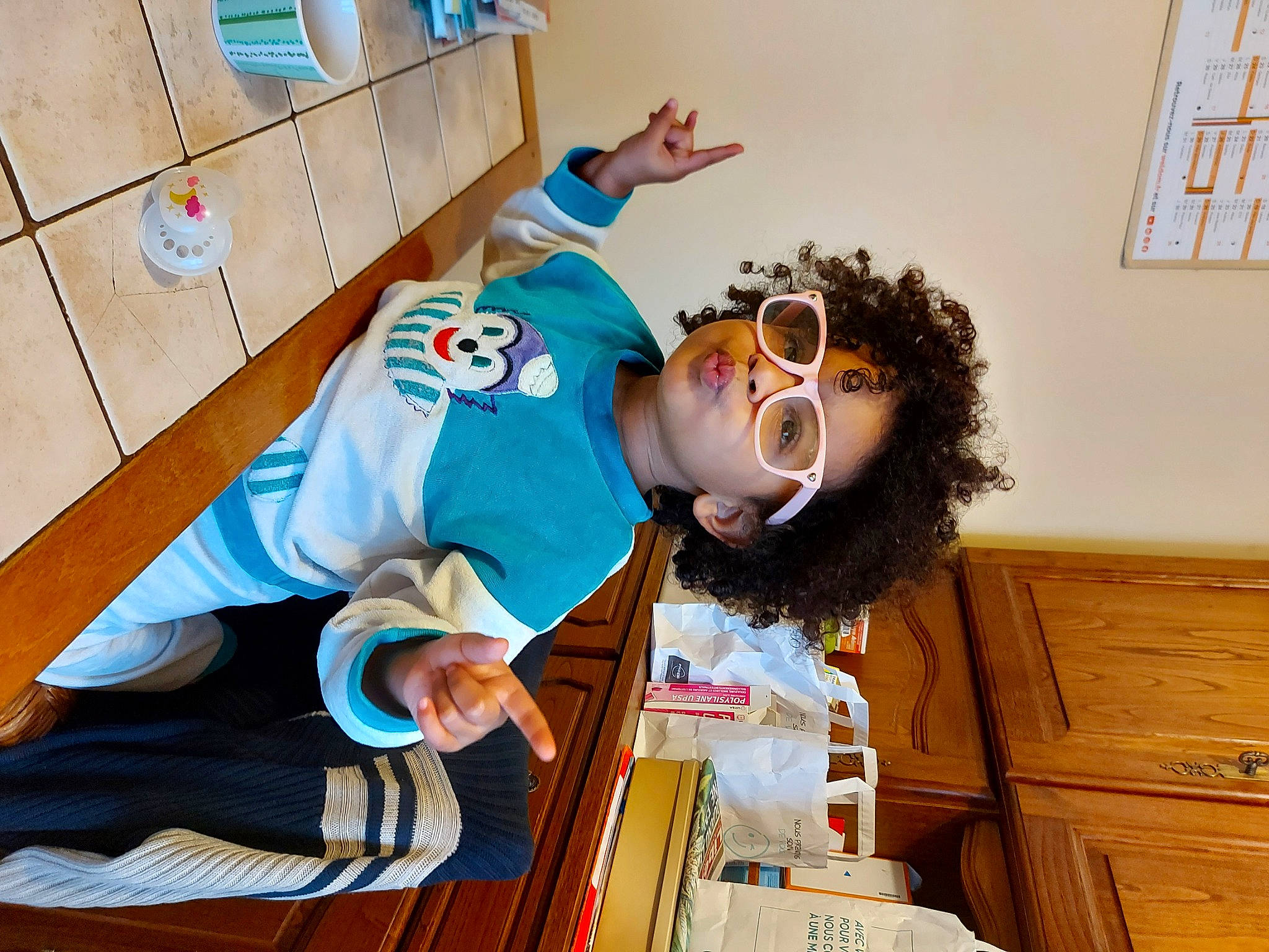 Gabriella participe au concours pour gagner de l'argent avec cette photo : beard, cabinetry, chest_of_drawers, chiffonier, child, costume, cupboard, drawer, dresser, eyewear, fun, fur, happy, person, picture_frame, room, smile, t_shirt, vision_care, wood