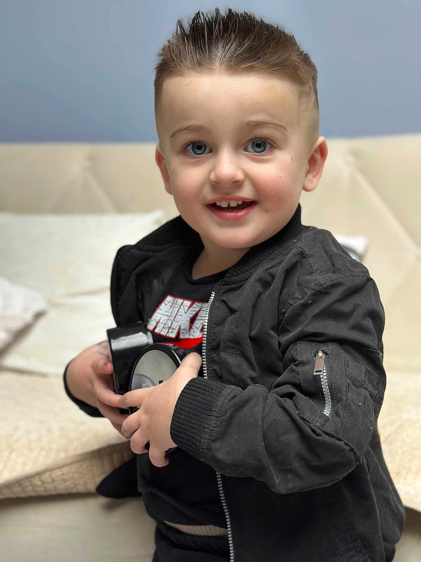Edior joined the competition — help win amazing prizes! bodypart, boy, child, clothing, coat, couch, face, finger, furniture, hand, happy, head, jacket, male, pants, person, photography, portrait, sitting, smile