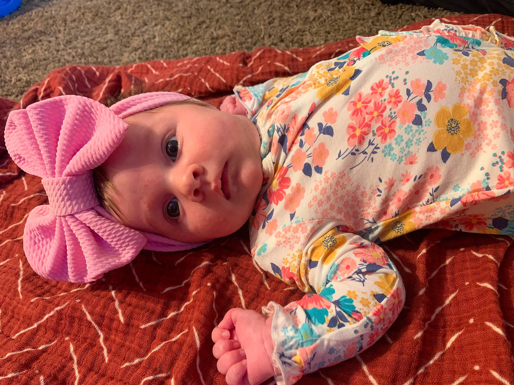 Josephine is registered to the contest to win money with this photo: child, doll, eye, eyelash, face, fawn, grass, hair, hairstyle, head, headwear, lip, neck, orange, person, pink, plant, skin, sleeve, textile