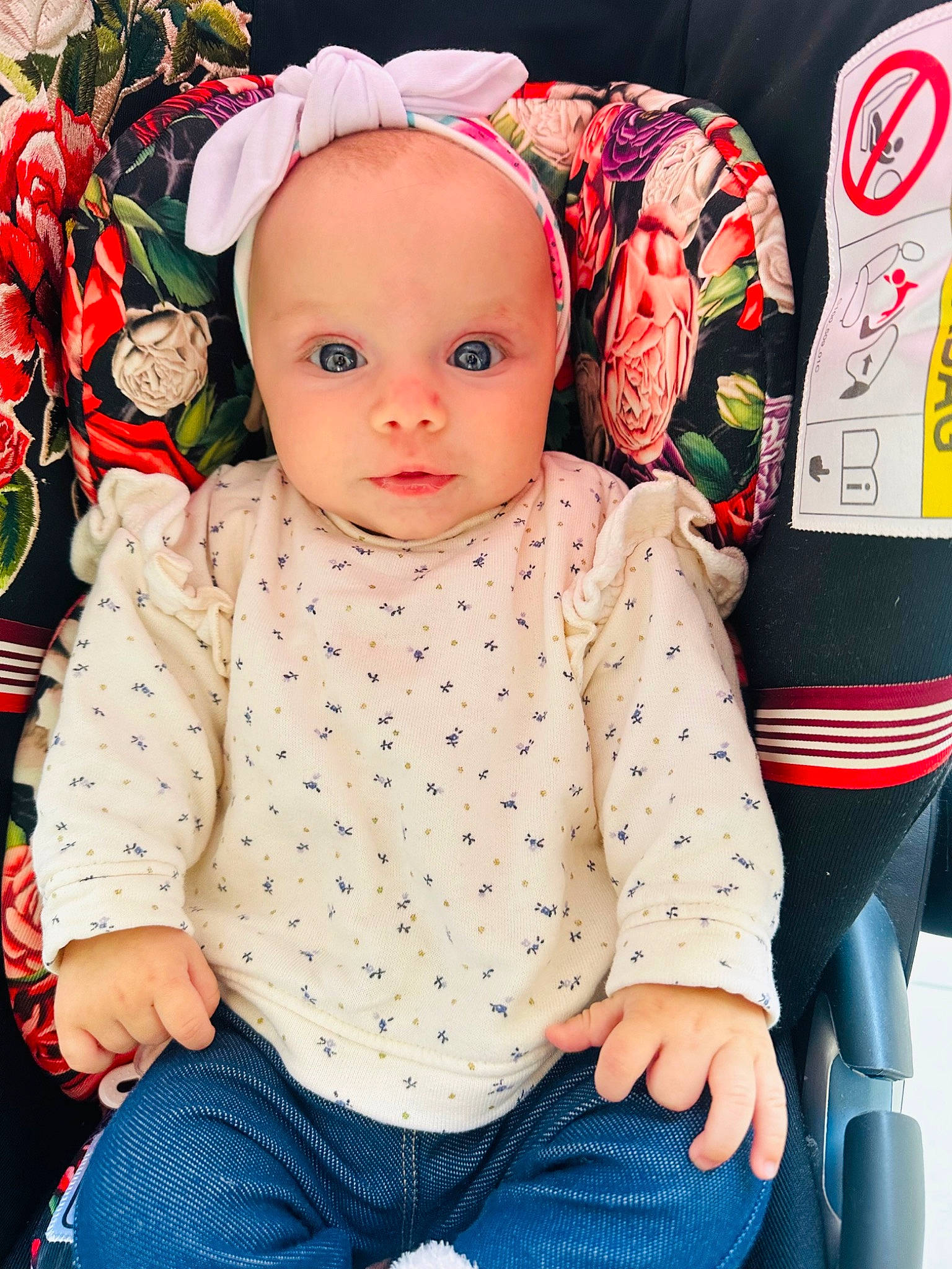 Milana a rejoint le concours — aidez-le/la à gagner de superbes lots ! baby, baby_toddler_clothing, cap, cheek, child, doll, event, flower, happy, headgear, outerwear, pattern, person, petal, pink, product, rose, sitting, sleeve, toddler