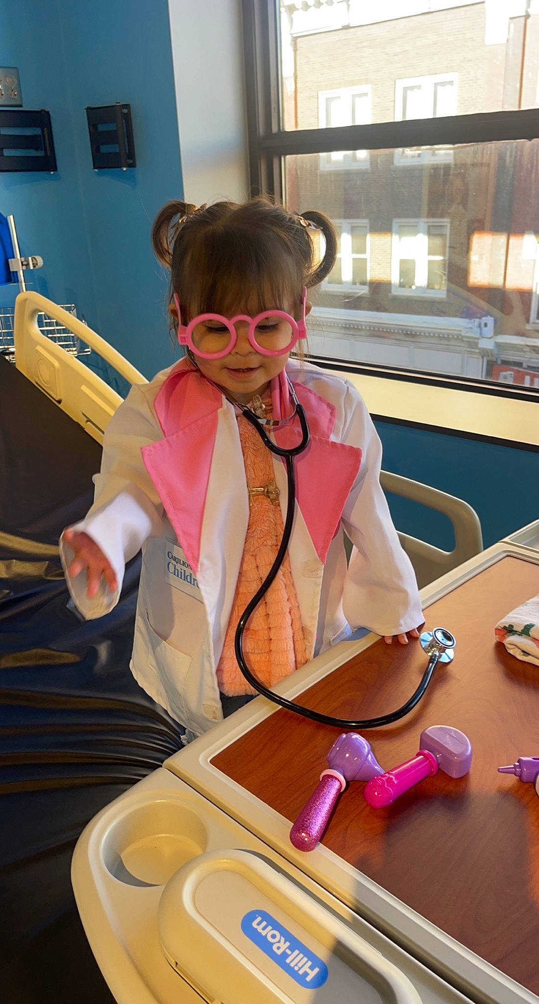 Kaylani is registered to the contest to win money with this photo: child, eyewear, fun, glove, goggles, kitchen_utensil, person, personal_protective_equipment, photography, room, snapshot, table, tableware, toddler, vision_care, window