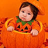 baby, child, pumpkin, halloween, costume, orange, portrait, face, infant, sitting, autumn, leaves, jack_o_lantern, hat, smiling, indoors, seasonal, photography, cute, holiday