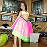 child, girl, smiling, portrait, fashion, dress, skirt, colorful, rainbow, indoor, home, wooden_wall, window, houseplant, balloon, furniture, barefoot, posing, happy, photography
