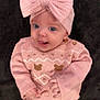 Gabriella joined the competition — help win amazing prizes! baby, infant, child, pink_sweater, knitwear, headband, bow, blue_eyes, cute, smiling, portrait, closeup, soft_blanket, indoors, warm_clothing, baby_girl, happy, cozy, small_hands, face