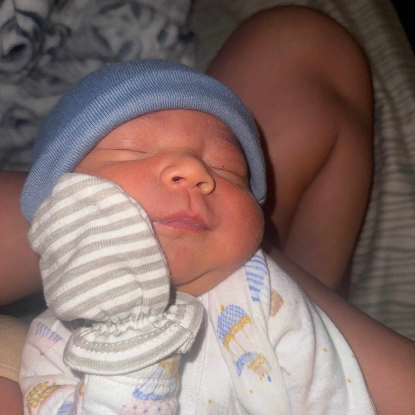 Kazan is registered to the contest to win money with this photo: baby, child, closeup, clothing, cute, face, hand, hat, indoor, infant, mittens, newborn, onesie, peaceful, person, resting, sleep, sleeping, soft_lighting, tiny