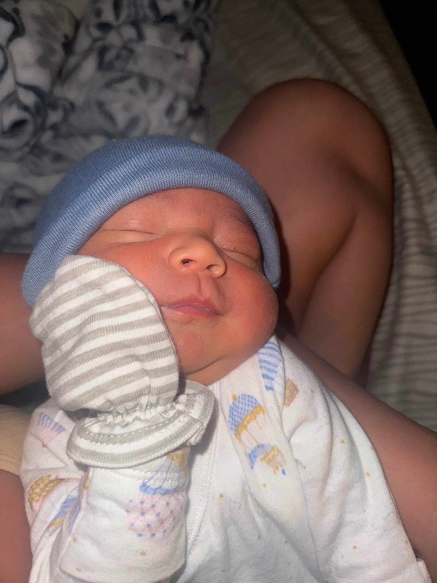 Kazan is registered to the contest to win money with this photo: baby, newborn, sleeping, hat, mittens, onesie, person, infant, face, hand, clothing, sleep, closeup, cute, resting, soft_lighting, indoor, child, tiny, peaceful