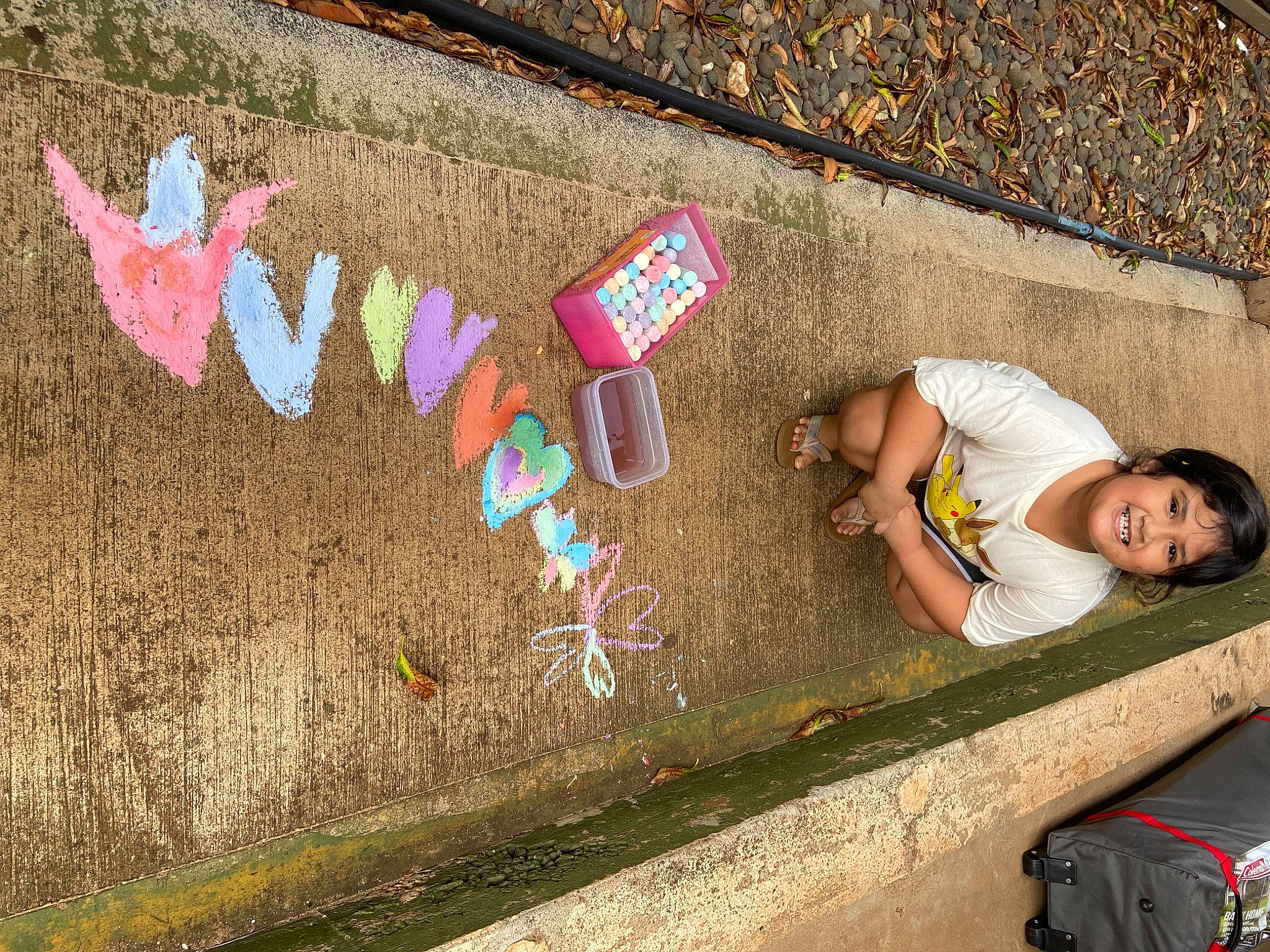 Kailey is registered to the contest to win money with this photo: asphalt, backpack, bag, brick, concrete, finger, font, fun, grass, joy, leisure, line, luggage_and_bags, person, public_space, road, road_surface, shadow, sidewalk, soil