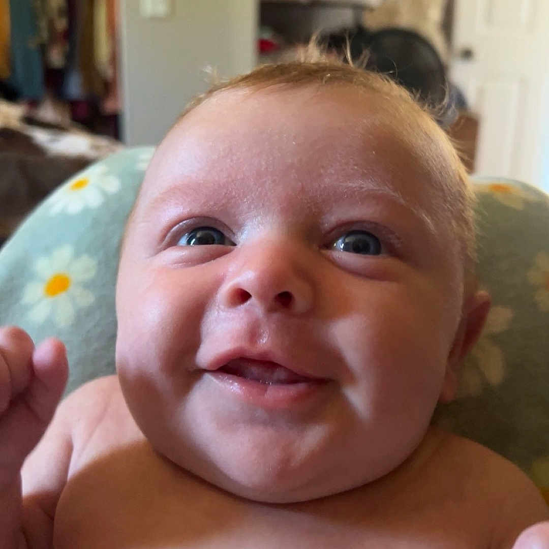 Brooks is registered to the contest to win money with this photo: architecture, baby, bodypart, building, cushion, face, finger, furniture, hand, happy, head, homedecor, indoors, laughing, newborn, person, photography, portrait, selfie, smile
