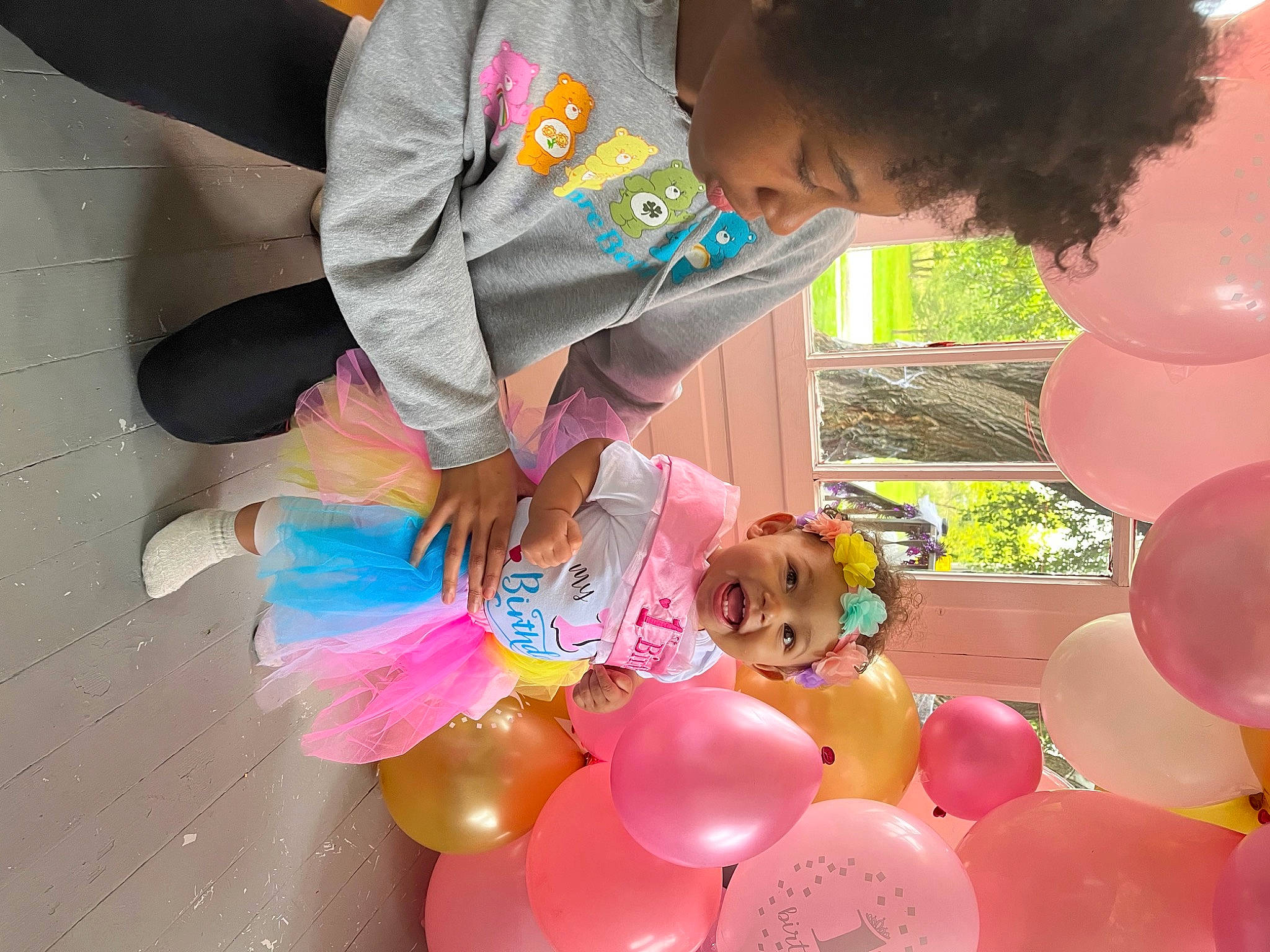Promise is registered to the contest to win money with this photo: baby_toddler_clothing, balloon, child, event, fun, happy, headwear, leisure, magenta, party, party_supply, person, pink, play, sharing, sweetness, toddler, toy, water