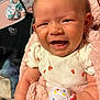 baby, infant, smiling, happy, blanket, pink, mittens, clothing, ladybug_print, cute, indoor, closeup, person, skin, face, head, newborn, soft, warm, cozy
