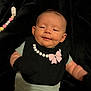 Autumn joined the competition — help win amazing prizes! baby, infant, black_bib, pink_bow, black_mittens, light_blue_onesie, blanket, lying_down, face, smile, cute, child, indoors, soft_texture, close_up, portrait, newborn, baby_accessory, relaxed, happy