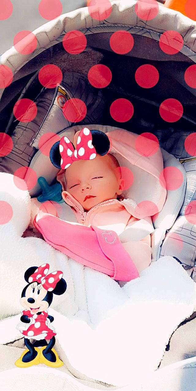 Tania participe au concours pour gagner de l'argent avec cette photo : arm, baby, baby_toddler_clothing, child, event, finger, hand, happy, hat, linens, magenta, pattern, person, petal, pink, product, red, skin, textile, thigh