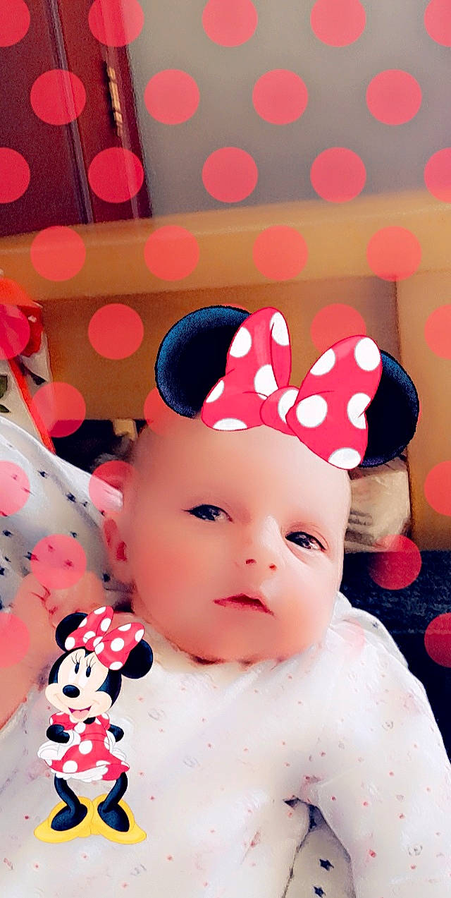 Tania participe au concours pour gagner de l'argent avec cette photo : baby, baby_toddler_clothing, cap, cheek, child, costume_hat, design, facial_expression, font, fun, happy, head, headwear, magenta, party_supply, pattern, person, pink, red, textile