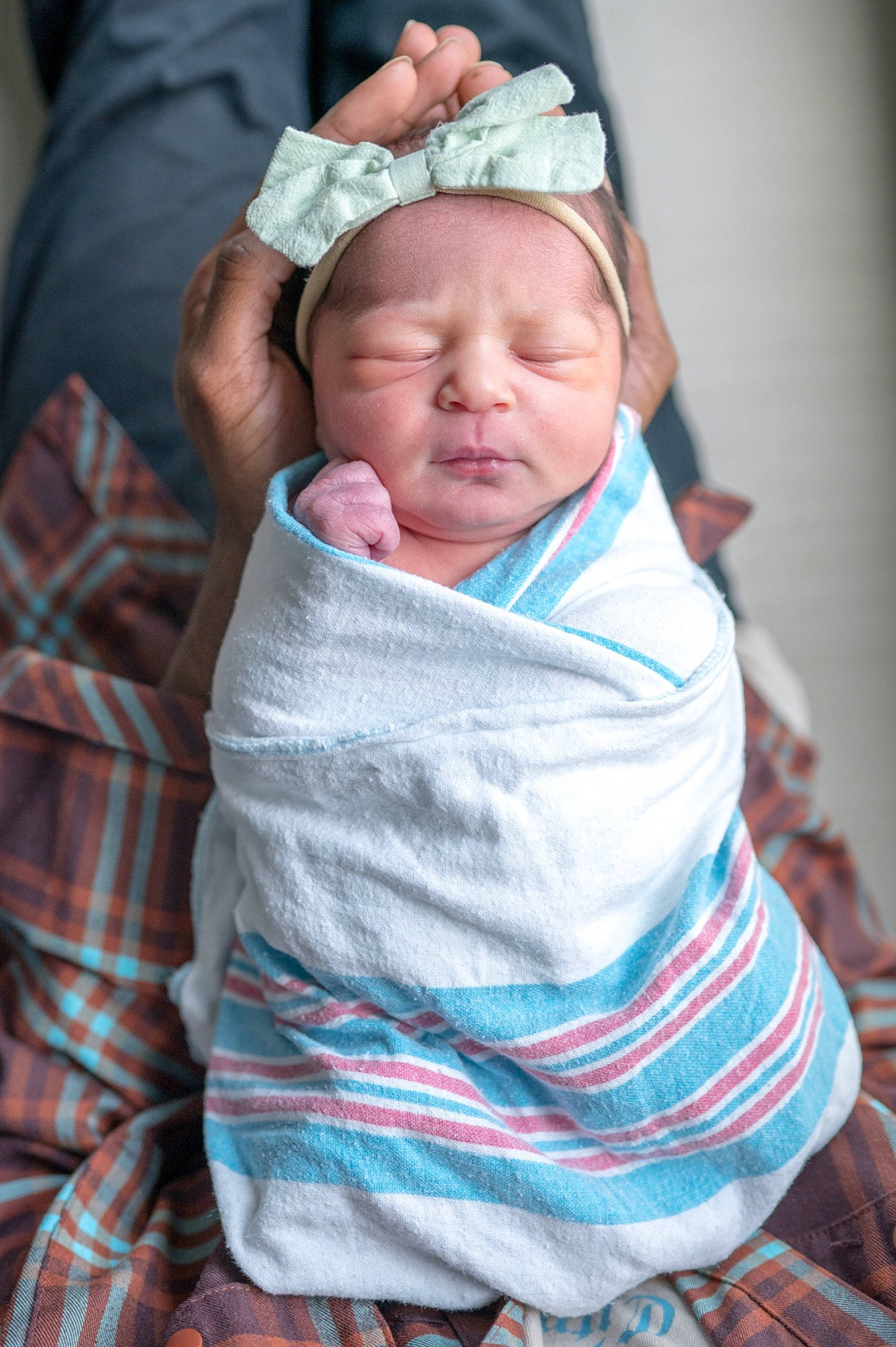 Delilah is registered to the contest to win money with this photo: baby, baby_products, baby_toddler_clothing, cheek, child, chin, comfort, eye, face, grass, headwear, lip, mammal, mouth, nose, people, person, sitting, skin, sleeve