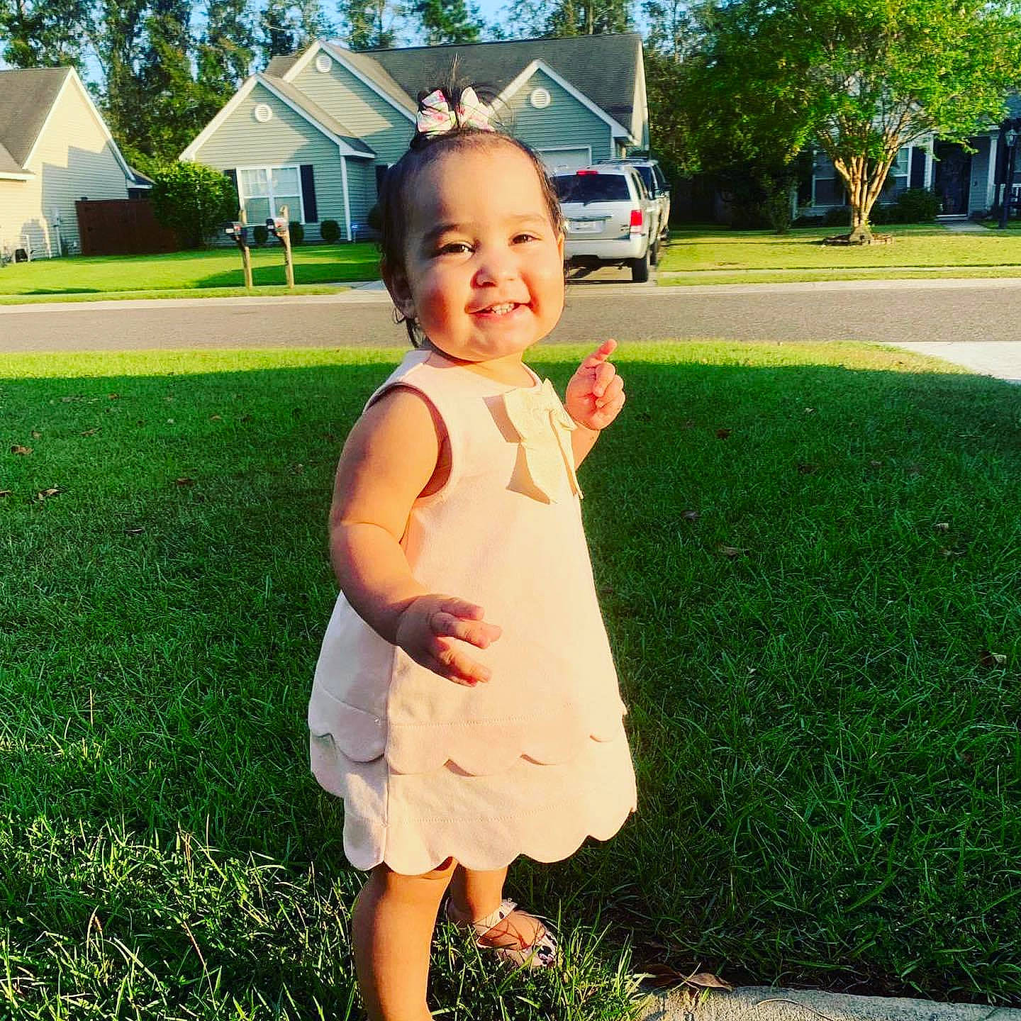 Laura Sophia is registered to the contest to win money with this photo: child, dress, grass, grass_family, green, happy, head, joy, lawn, leaf, person, plant, smile, spring, standing, summer, toddler, vacation