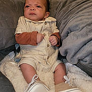 Elijah joined the competition — help win amazing prizes! baby, infant, child, clothing, shoes, blanket, cushion, indoor, portrait, expression, sitting, cute, soft, warm, cozy, face, hands, footwear, apparel, person