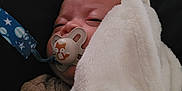 Elijah joined the competition — help win amazing prizes! baby, pacifier, blanket, sleeping, infant, cute, face, cozy, soft, resting, child, comfort, clothing, indoors, closeup, peaceful, newborn, warm, cute_animal, nap