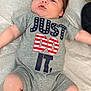 Wesson Ryan joined the competition — help win amazing prizes! baby, infant, child, onesie, gray_clothing, text_on_clothing, lying_down, medical_table, skin, face, hair, legs, arms, foot, hand, expression, curious, indoors, fabric, snap_buttons