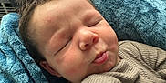 Wesson Ryan is registered to the contest to win money with this photo: baby, sleeping, close_up, face, blanket, soft_texture, cozy, cute, infant, child, clothing, resting, peaceful, indoors, portrait, young, head, skin, mouth, eyelids