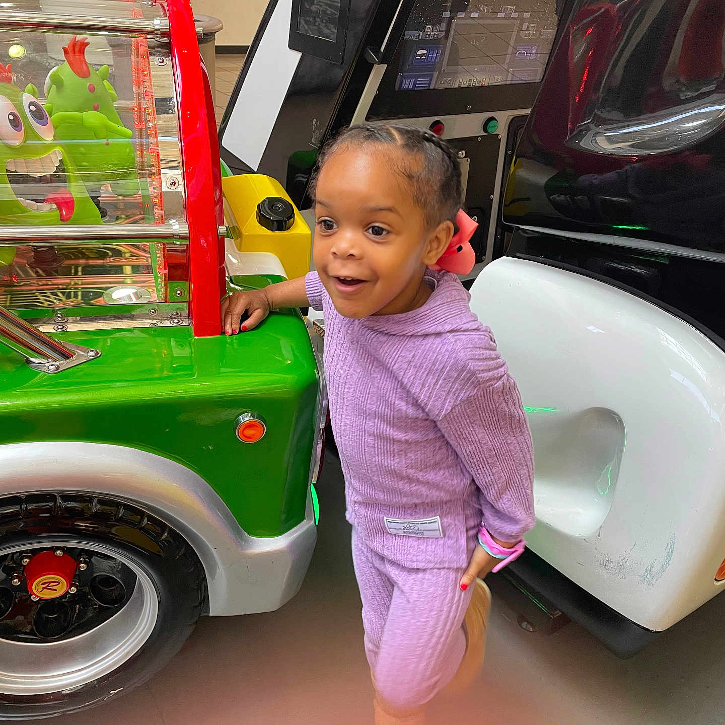 Zuri joined the competition — help win amazing prizes! alloywheel, bathroom, car, carwheel, child, face, female, girl, head, indoors, machine, person, photography, portrait, room, spoke, tire, transportation, vehicle, wheel