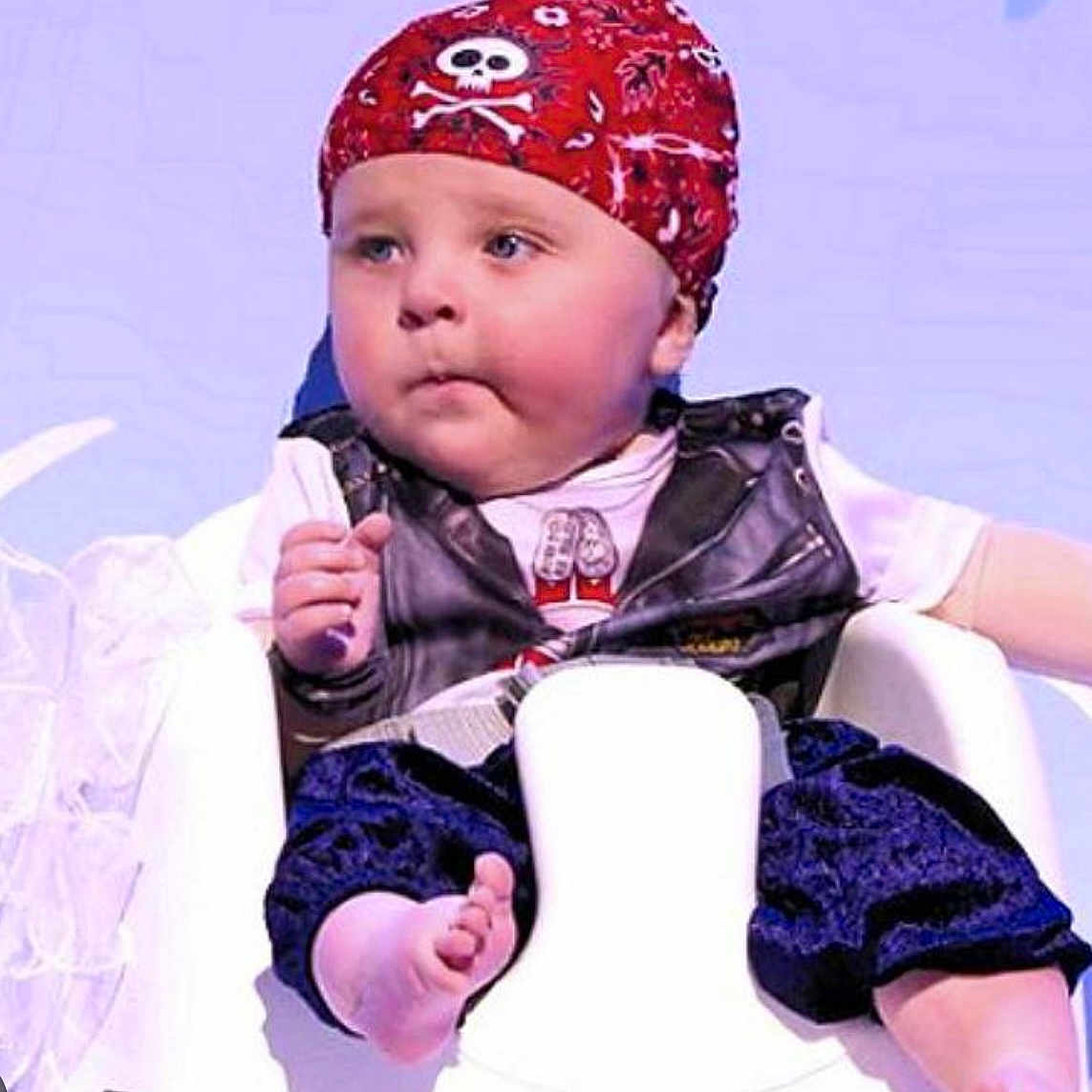 Bart Harley Jarvis joined the competition — help win amazing prizes! accessories, baby, bathroom, bonnet, cap, clothing, coat, face, hat, head, indoors, jacket, person, photography, portrait, potty, room, sitting, toilet, toy