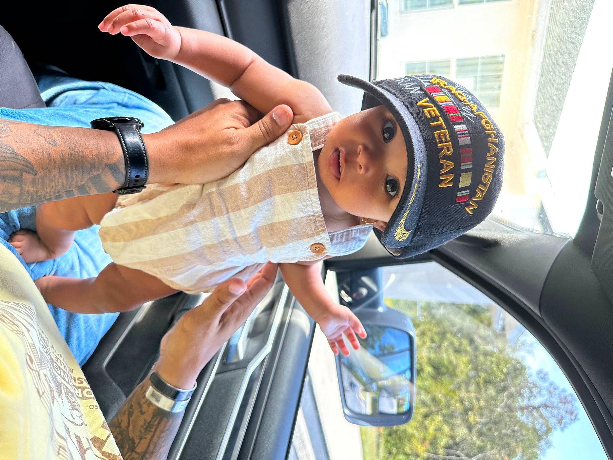 Keilani is registered to the contest to win money with this photo: arm, auto_part, automotive_design, automotive_exterior, automotive_lighting, automotive_mirror, automotive_side_view_mirror, cap, car, eyewear, gesture, hand, hat, headwear, light, mirror, motor_vehicle, person, photograph, rear_view_mirror