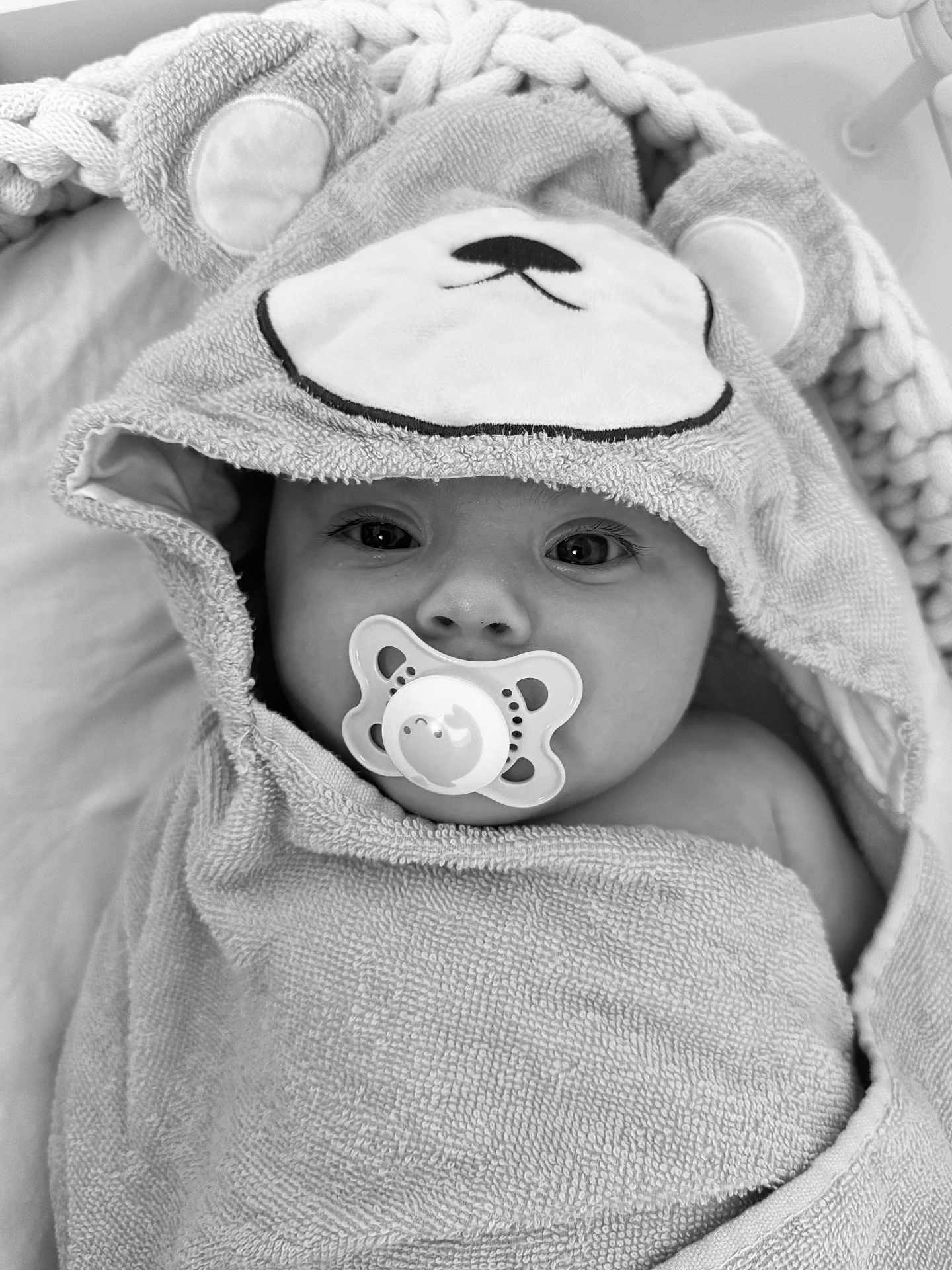Riley-Rae joined the competition — help win amazing prizes! baby, towel, hood, pacifier, face, eyes, cute, infant, wrapped, soft, texture, closeup, child, portrait, blanket, comfort, sleepy, indoors, adorable, black_and_white