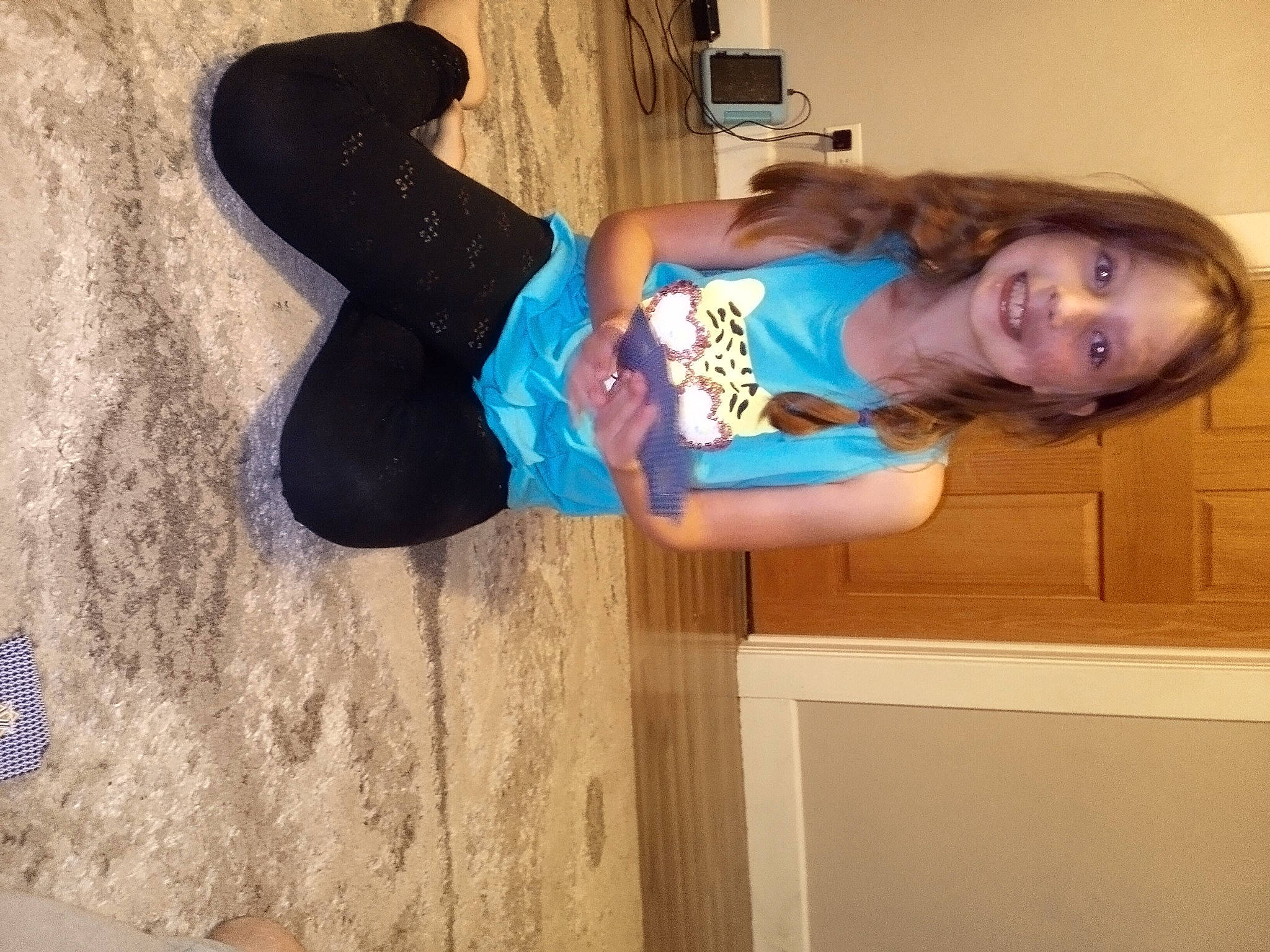 Rachel is registered to the contest to win money with this photo: arm, elbow, electric_blue, fun, happy, hardwood, human_leg, joy, knee, leisure, magenta, person, smile, sportswear, t_shirt, thigh, waist, wood, wrist