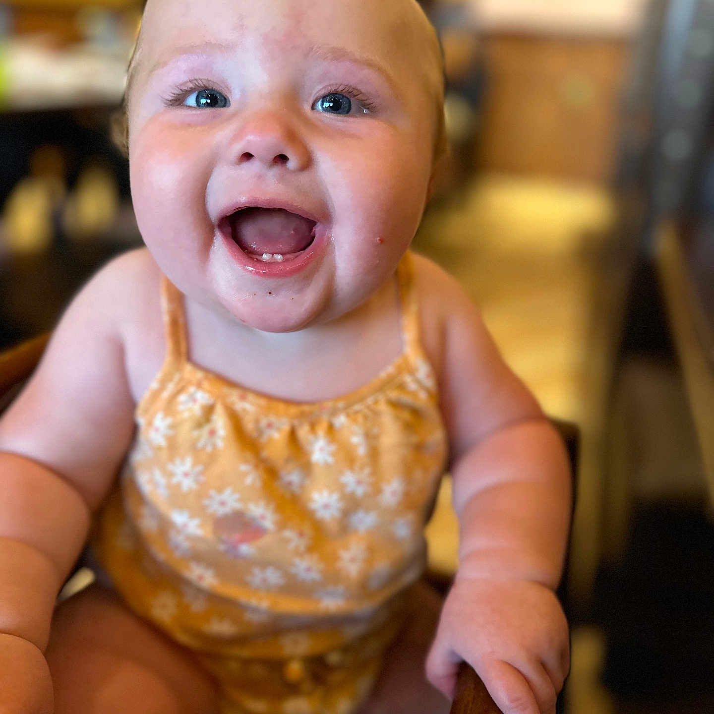 Berkley is registered to the contest to win money with this photo: baby, babylaughing, bodypart, clothing, dress, face, finger, furniture, hand, happy, head, laughing, mouth, person, photography, portrait, sitting, smile, teeth, wood