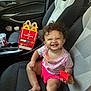 Oaklen joined the competition — help win amazing prizes! toddler, child, smiling, curly_hair, car_interior, car_seat, happy_meal, fast_food, french_fries, pink_shorts, patterned_shirt, seatbelt, window, door, cup_holder, drink, sunlight, daylight, happy, playful