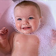 Isabel is registered to the contest to win money with this photo: baby, blue_eyes, bath, bubbles, foam, water, smile, happy, skin, infant, child, cute, portrait, close_up, relaxation, cleaning, young, playful, pink, wet