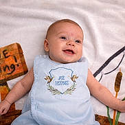 Jase joined the competition — help win amazing prizes! baby, infant, smiling, blue_outfit, blanket, gone_fishing_sign, fishing_rod, cattails, happy, lying_down, cute, child, portrait, playful, outdoor_theme, soft_texture, young, person, relaxing, decorative