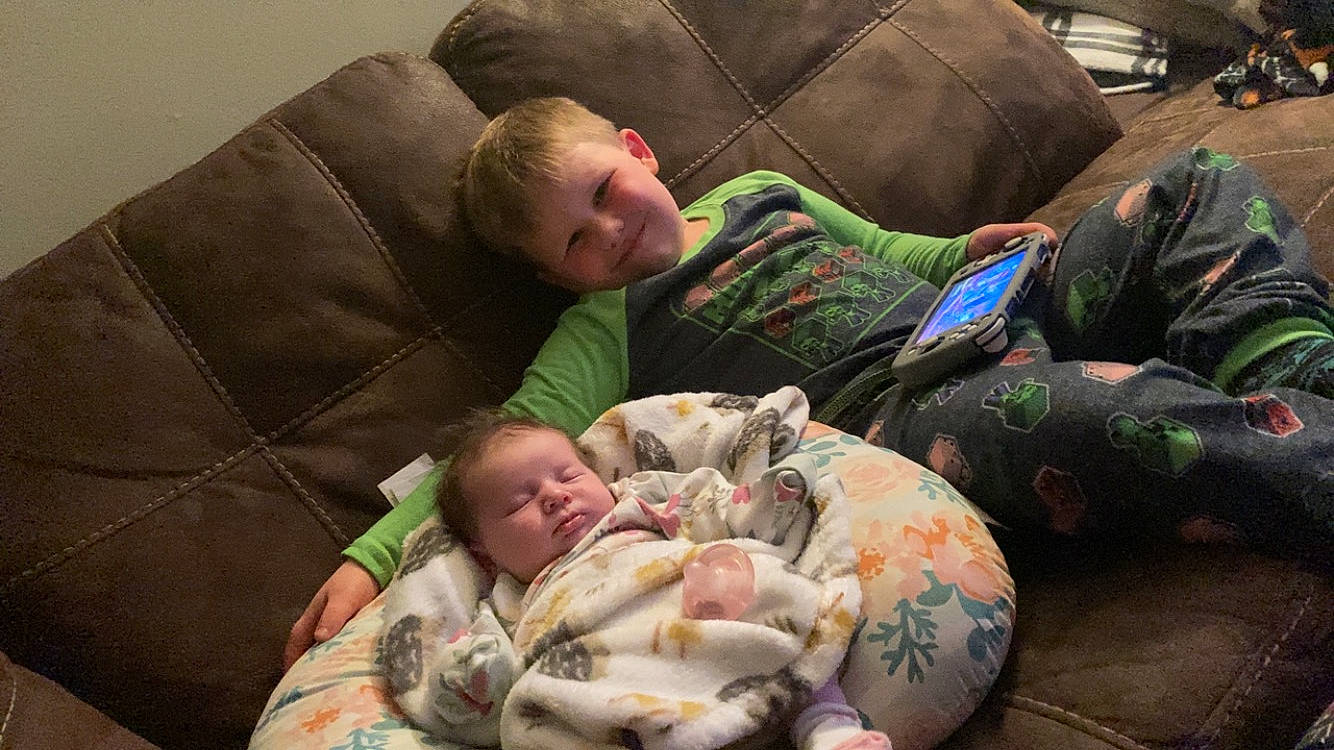 Xavier is registered to the contest to win money with this photo: baby, bedtime, child, comfort, couch, fun, joy, linens, nap, person, room, sitting, sleep, smile, toddler