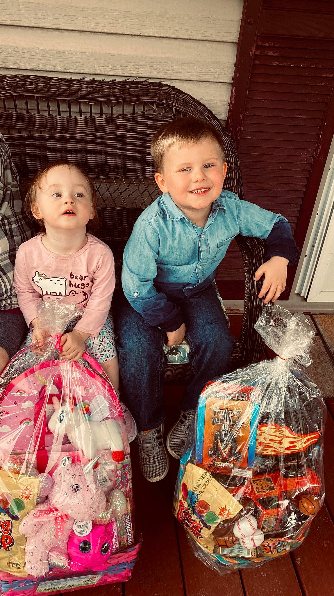 Xavier is registered to the contest to win money with this photo: baby_toddler_clothing, basket, child, day_dress, dress, event, facial_expression, formal_wear, fun, happy, holiday, joy, lap, one_piece_garment, pattern, person, photograph, present, sitting, smile