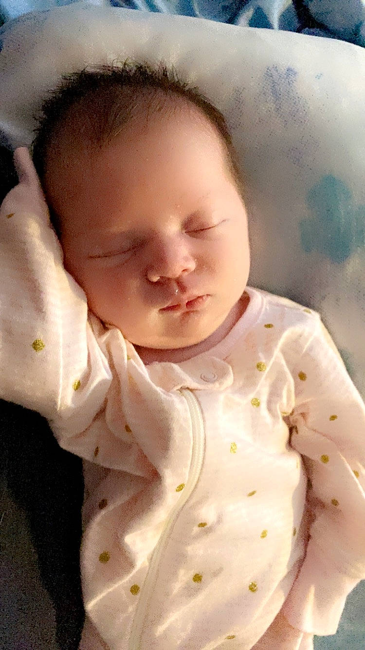 Alexandria is registered to the contest to win money with this photo: baby, baby_toddler_clothing, cheek, child, chin, collar, comfort, face, happy, linens, lip, nose, peach, person, portrait_photography, skin, sleeve, toddler