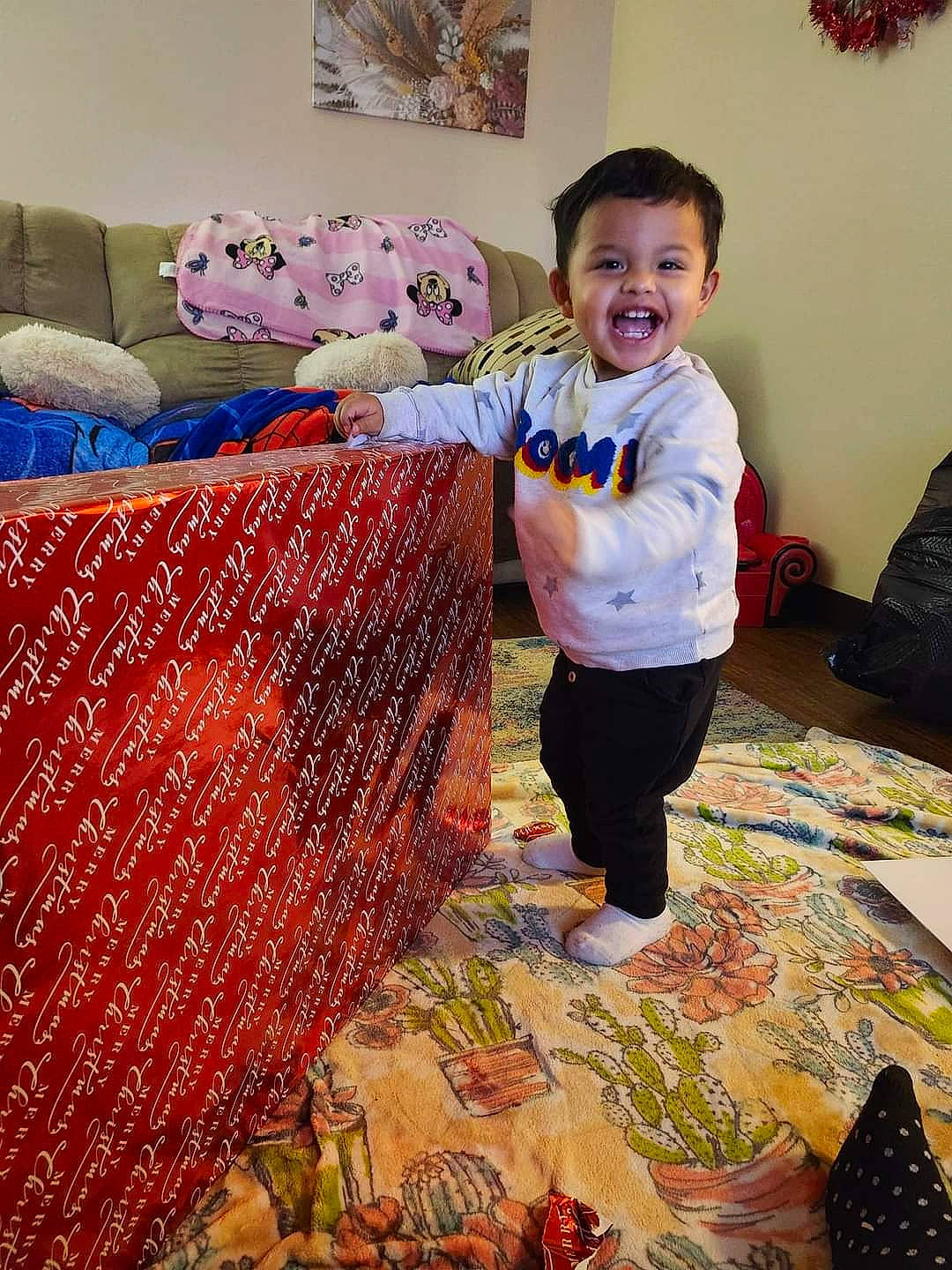 Braylon is registered to the contest to win money with this photo: art, baby, bag, carpet, child, comfort, couch, craft, event, flooring, fun, joy, linens, luggage_and_bags, pattern, person, room, smile, textile, toddler