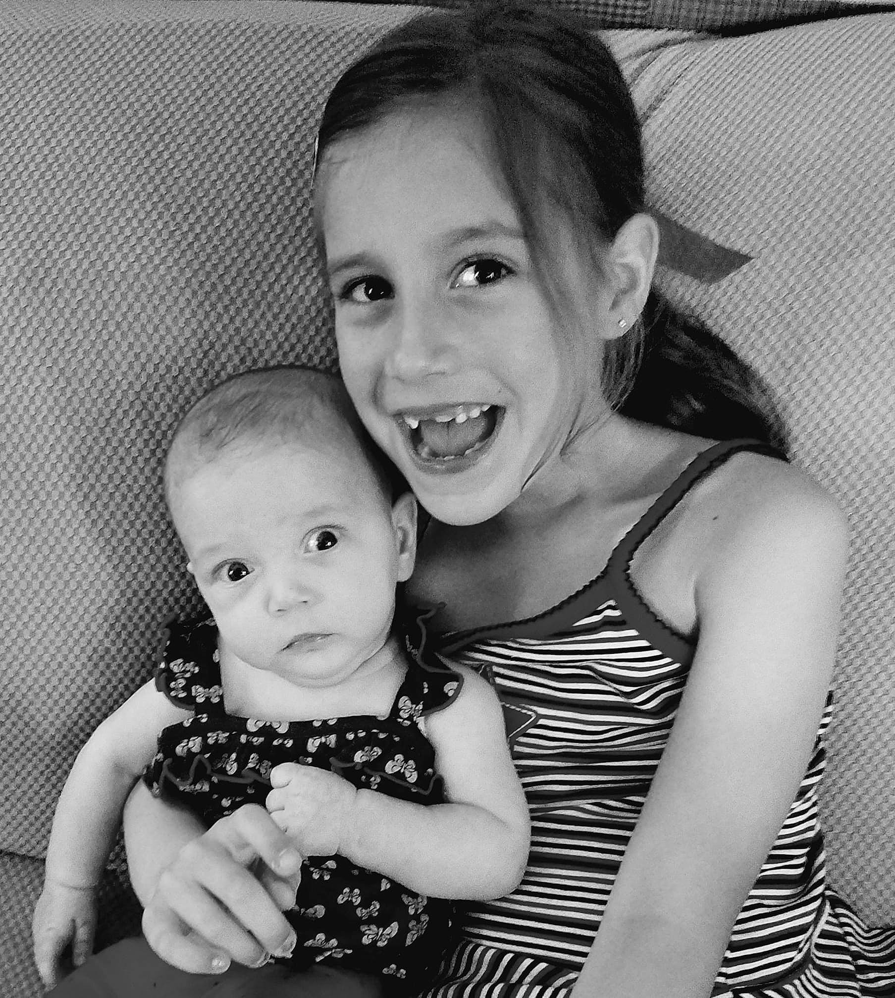 Hadley is registered to the contest to win money with this photo: beauty, black, black_and_white, child, day, emotion, face, facial_expression, girl, head, infant, joy, monochrome_photography, nose, people, person, photograph, photography, skin, smile