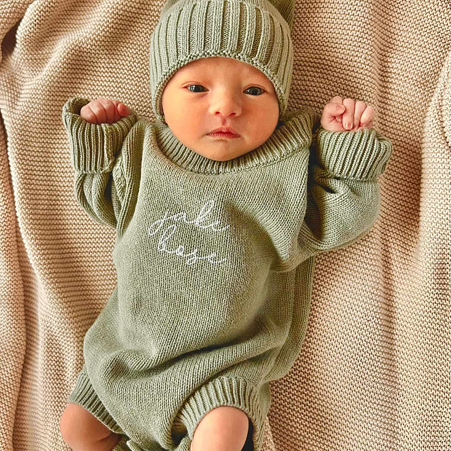 Jake joined the competition — help win amazing prizes! baby, beanie, blanket, bodypart, bonnet, cap, clothing, face, finger, glove, hand, hat, head, hood, knitwear, newborn, person, photography, portrait, sweater