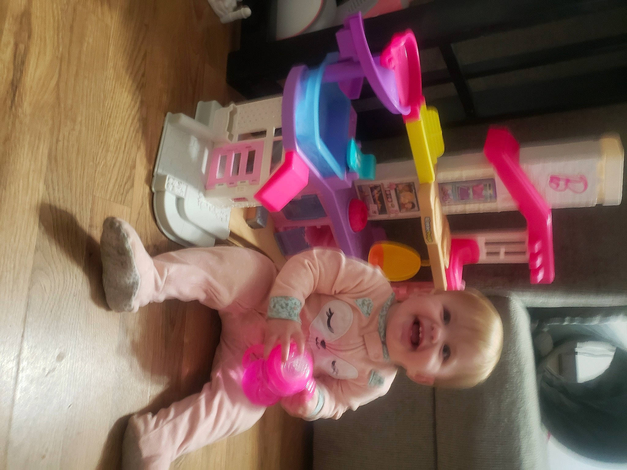 Liv joined the competition — help win amazing prizes! baby, baby_products, baby_toddler_clothing, child, finger, flooring, foot, fun, happy, hardwood, infant_bed, magenta, person, pink, room, smile, sock, stuffed_toy, toddler, toy