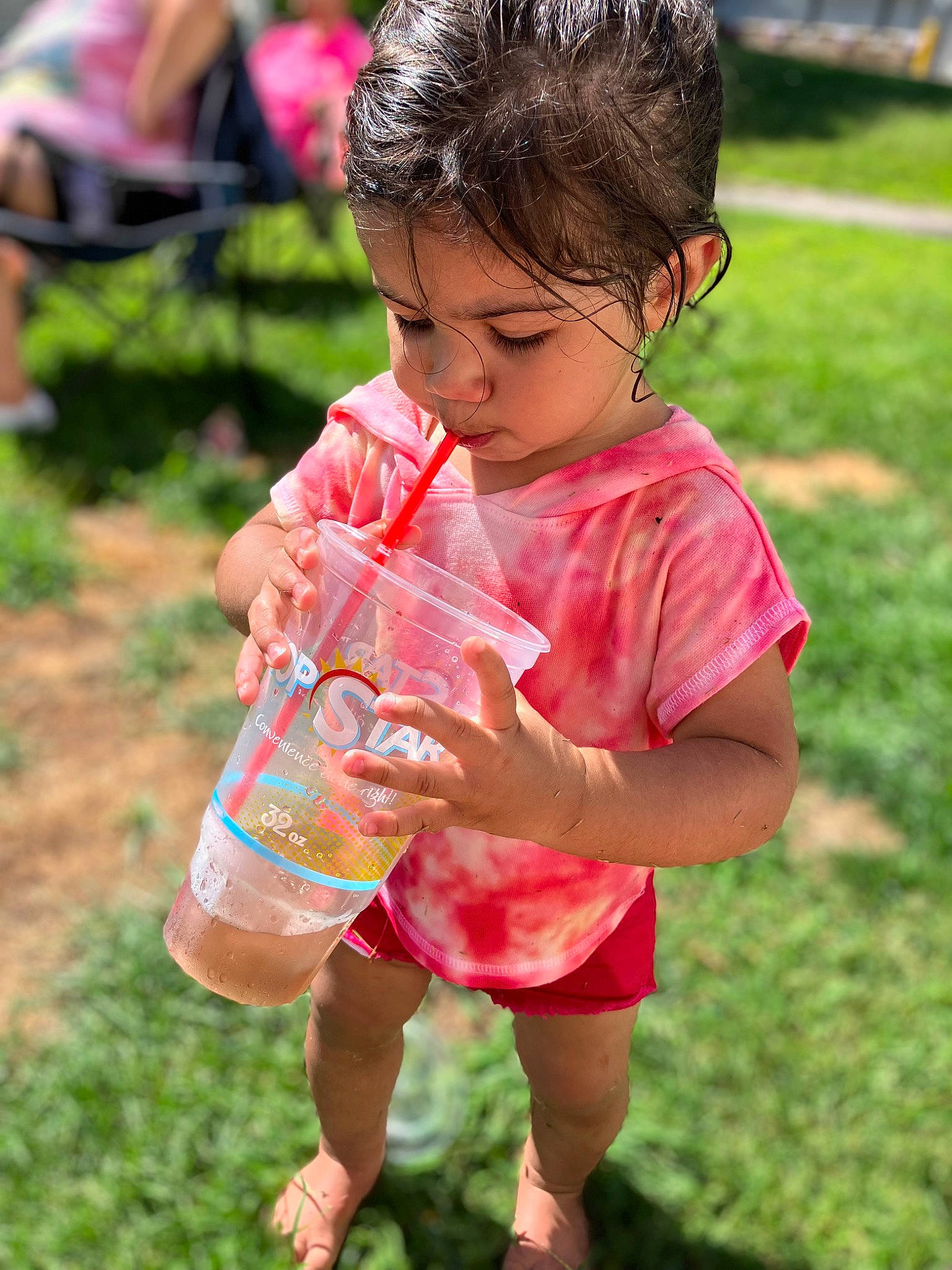 Lariaha is registered to the contest to win money with this photo: baby, baby_toddler_clothing, child, dress, fun, grass, grassland, happy, leisure, people_in_nature, person, picnic, pink, play, recreation, shorts, skin, soil, toddler, vacation