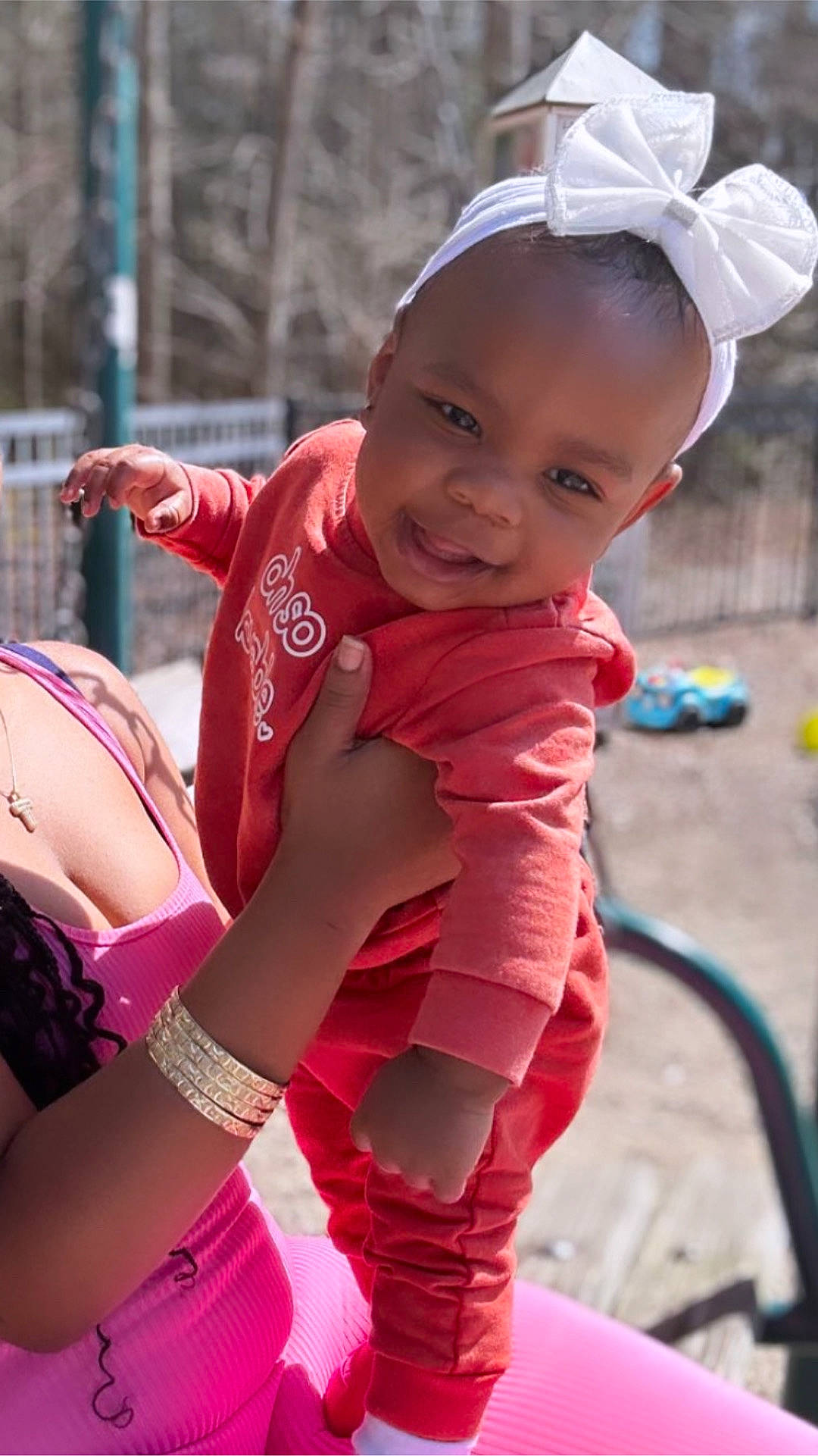 Kaylinn is registered to the contest to win money with this photo: arm, baby, baby_toddler_clothing, beauty, child, facial_expression, fun, grass, happy, joy, leisure, lip, magenta, person, pink, recreation, red, skin, smile, thigh