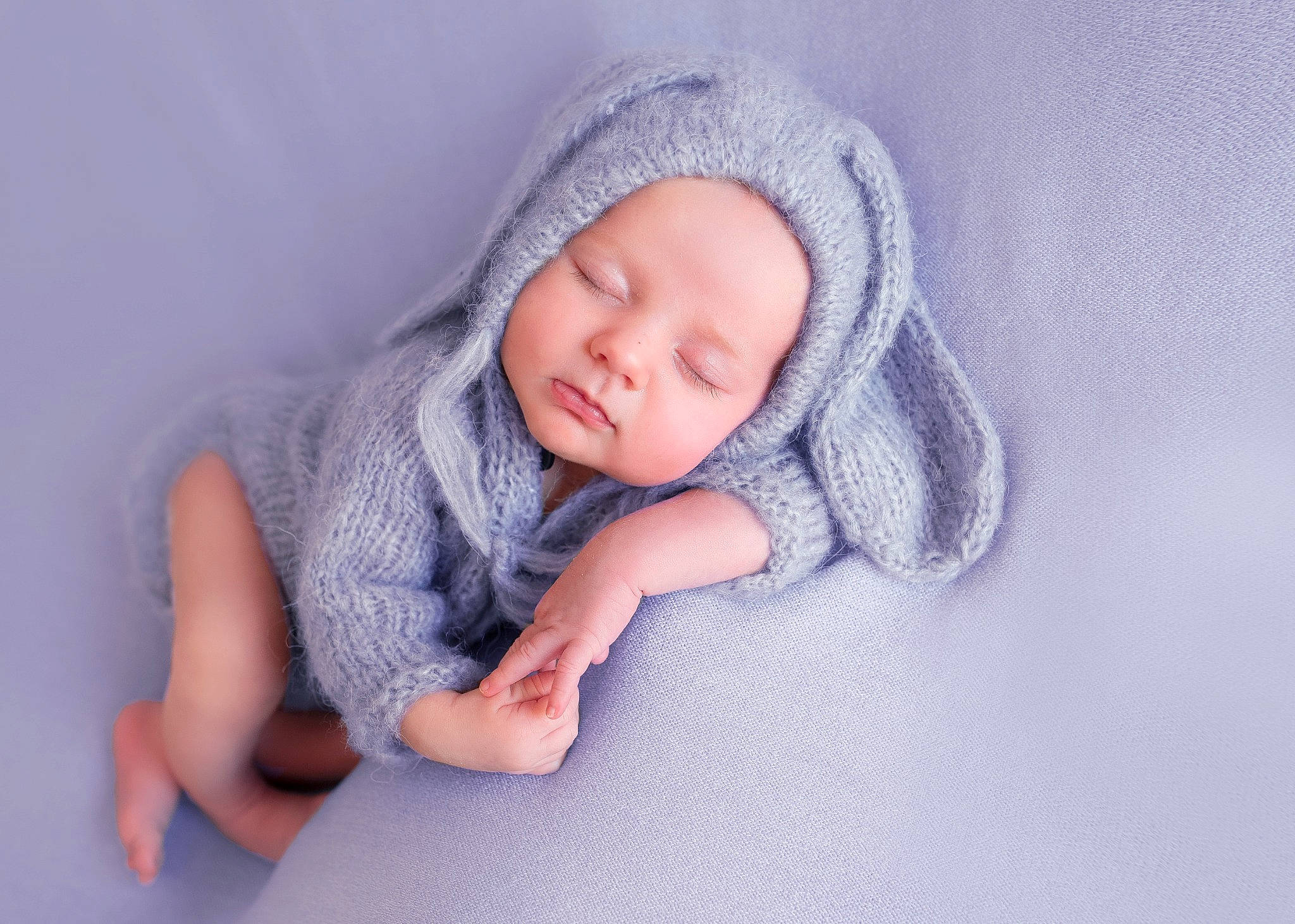 Nellie is registered to the contest to win money with this photo: arm, baby, baby_products, baby_sleeping, baby_toddler_clothing, cap, cheek, child, comfort, electric_blue, finger, grey, hand, headwear, human_body, knit_cap, linens, person, skin, sleeve