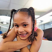 Promise joined the competition — help win amazing prizes! child, girl, smiling, braids, pigtails, portrait, happy, face, arms, indoor, blurred_background, person, cute, closeup, skin, hair, expression, childhood, casual, bright