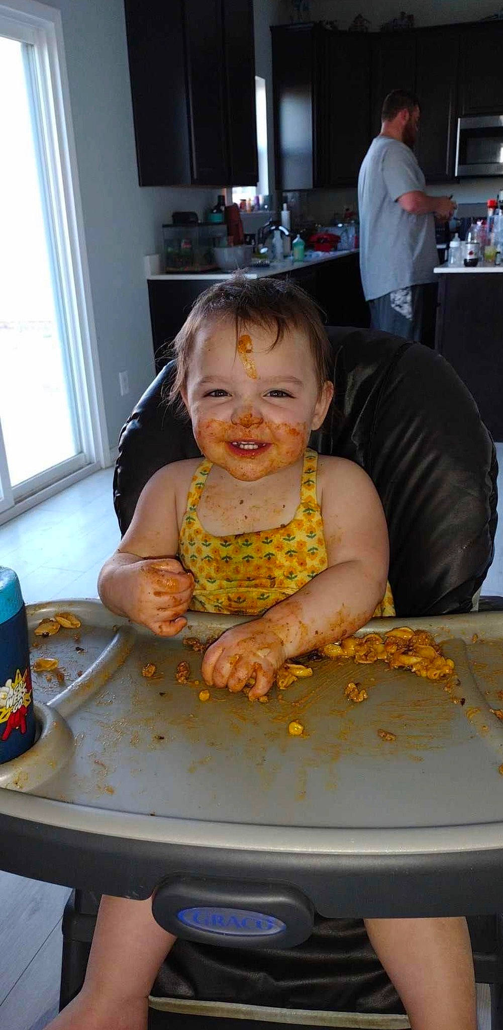 Adeline is registered to the contest to win money with this photo: baby, baby_toddler_clothing, baking, cabinetry, chair, child, cooking, cuisine, dish, event, flooring, food, joy, person, plate, sitting, smile, table, tableware, television