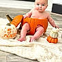 Luca joined the competition — help win amazing prizes! baby, pumpkin, infant, orange, decorative, blanket, floor, cute, child, holiday, autumn, seasonal, sitting, chubby, indoors, smiling, face, feet, hand, head
