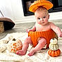 baby, pumpkin, orange, blanket, floor, hand, decor, cute, infant, autumn, holiday, fall, sitting, costume, headwear, skin, foot, toes, indoor, celebration