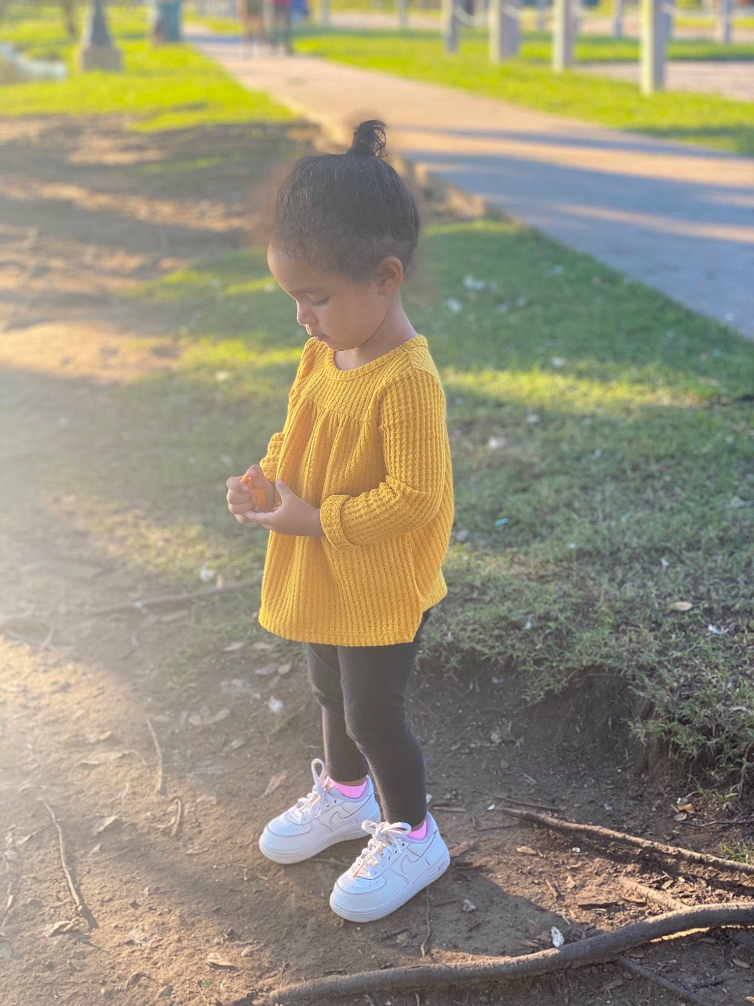 Aubreigh is registered to the contest to win money with this photo: asphalt, fun, grass, grassland, human_leg, landscape, lawn, leaf, leisure, nature, people_in_nature, person, plant, recreation, road, road_surface, sidewalk, sunlight, toddler, tree