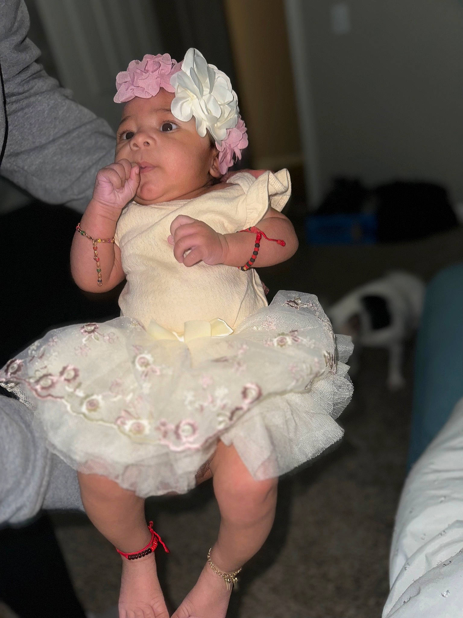 Liyah is registered to the contest to win money with this photo: baby_toddler_clothing, bridal_accessory, child, day_dress, dress, embellishment, event, flower, formal_wear, fun, hair_accessory, happy, hat, headpiece, headwear, human_leg, person, petal, pink, thigh