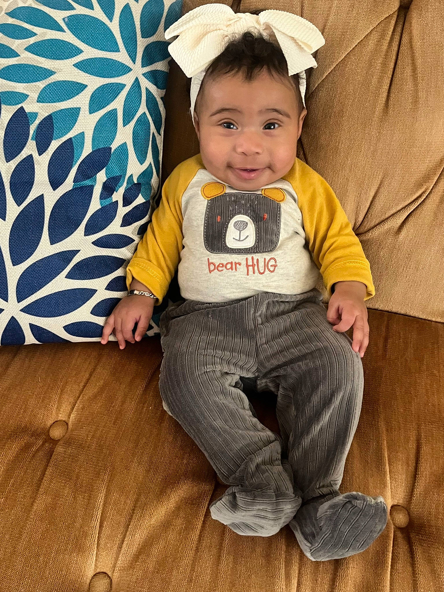 Skylar is registered to the contest to win money with this photo: baby, baby_toddler_clothing, cheek, child, comfort, costume_hat, face, fashion_accessory, flash_photography, fun, grass, happy, pattern, person, portrait_photography, sitting, sleeve, smile, t_shirt, toddler